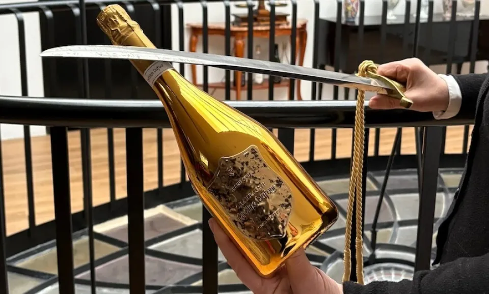 Sabering a bottle of Cuvée Prestige Gold